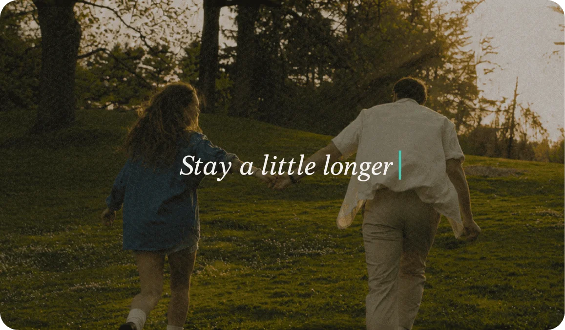 Photo of a couple holding hands with the caption Stay A Little Longer in italic text