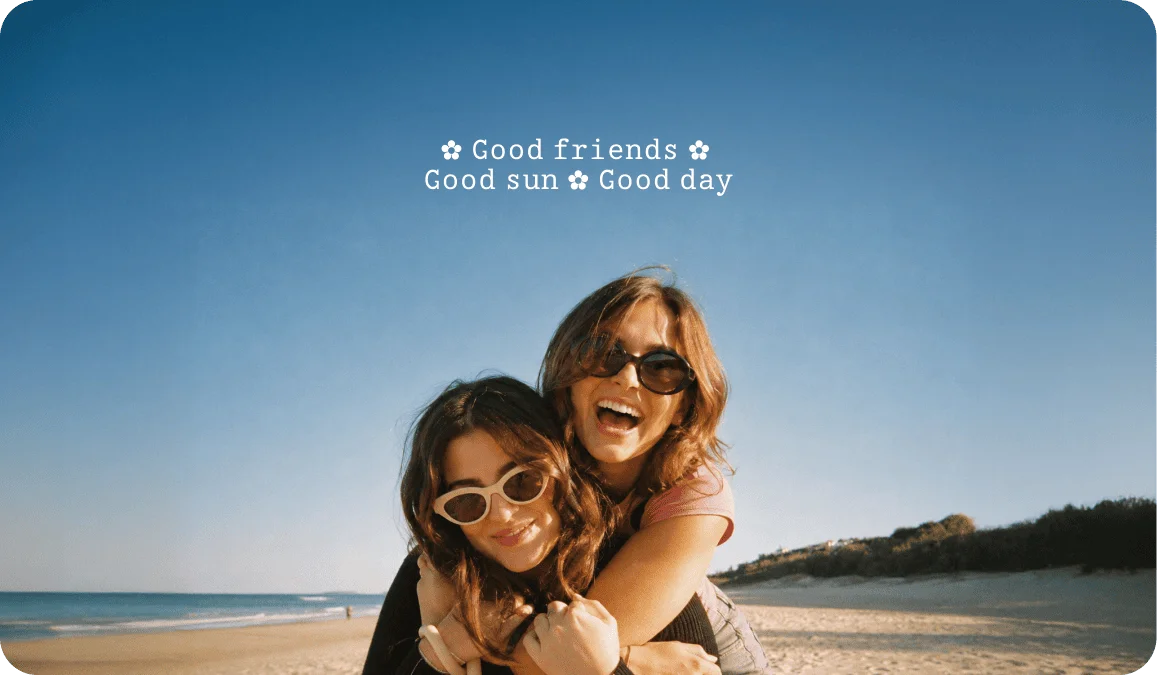 Beach photo of two friends captioned Good Friends Good Sun Good Day in tiny text